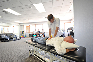 Therapists working on patient back